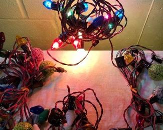 Lot 2484. $40.00. 4 vintage strands. 2 strands have glittered globes! 1 extra strand for parts (we couldn't get it to turn on).