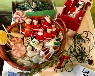 Lot 2487. $160.00. A huge lot of vintage Christmas. Includes a basket filled with vintage flocked Christmas light covers (a Radiant Decorative Light booklet), a Christmas Basket, 2 Gorham Christmas Dolls, one smaller Porcelain doll, 2 vintage stands of lights (1 has a few glass snowflakes).