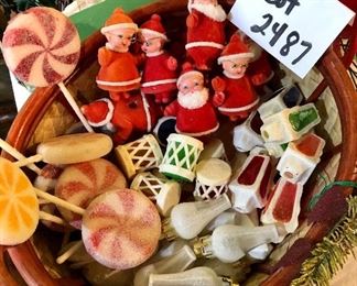 Lot 2487. $160.00. A huge lot of vintage Christmas. Includes a basket filled with vintage flocked Christmas light covers (a Radiant Decorative Light booklet), a Christmas Basket, 2 Gorham Christmas Dolls, one smaller Porcelain doll, 2 vintage stands of lights (1 has a few glass snowflakes).