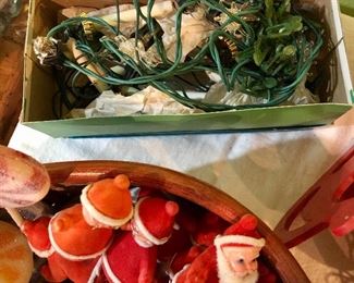 Lot 2487. $160.00. A huge lot of vintage Christmas. Includes a basket filled with vintage flocked Christmas light covers (a Radiant Decorative Light booklet), a Christmas Basket, 2 Gorham Christmas Dolls, one smaller Porcelain doll, 2 vintage stands of lights (1 has a few glass snowflakes).
