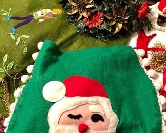 Lot 2496. $40.00. Vintage-Kitsch. Faux floral, 2 wax santas, 2 sequined ornaments, felted skirt, runner and toilet seat cover (hilarious), boxed ornament, gold basket.