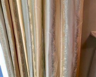 Lot 2443. $550.00. Custom-Made Fine Silk and lined Draperies: Currently covering the openings of 173" of windows (corner is 84"x41", add'l window is 48"wide) color is soft blue and tan with embroidery flower stripes. Includes valance and rings. The fabric alone would cost a fortune. Getting it custom made is sky-high.