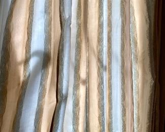 Lot 2443. $550.00. Custom-Made Fine Silk and lined Draperies: Currently covering the openings of 173" of windows (corner is 84"x41", add'l window is 48"wide) color is soft blue and tan with embroidery flower stripes. Includes valance and rings. The fabric alone would cost a fortune. Getting it custom made is sky-high.
