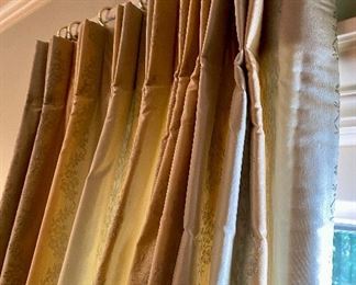 Lot 2443. $550.00. Custom-Made Fine Silk and lined Draperies: Currently covering the openings of 173" of windows (corner is 84"x41", add'l window is 48"wide) color is soft blue and tan with embroidery flower stripes. Includes valance and rings. The fabric alone would cost a fortune. Getting it custom made is sky-high.