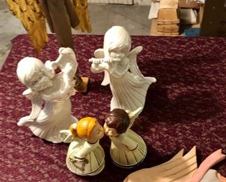 Lot 2529. $38.00. Who doesn't need an angel? This lot includes 6 angels. One is a wood carving wall hanging, pair of white iridescent angels, pair of kissing angels, and a tall slender angel (19").
