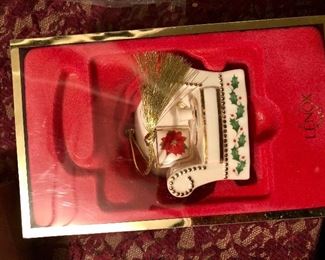 Lot 2530. $60.00 All the ornaments! Sweet little ornament tree, and ornament 18 ornaments, ornament tree with candles, one ornament is a Lenox Holiday Home Chair, 3 are hummel ornaments. 1 peacock, 2 baskets.