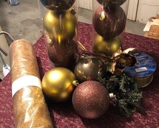 Lot 2532. $20.00. 9 Elegant looking larger Christmas ornaments, a new roll of "Gold Wrappe" for decorating, and one large roll of decorator Holiday Ribbon.