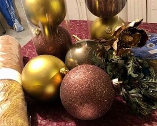 Lot 2532. $20.00. 9 Elegant looking larger Christmas ornaments, a new roll of "Gold Wrappe" for decorating, and one large roll of decorator Holiday Ribbon, and a Christmas swag.