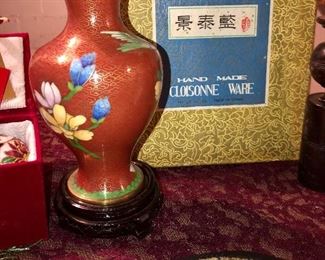 Lot 2534. $60.00. Travel the world in one Lot! Cloisonne vase with stand. 1 cloisonne ornament and 1 green glass ornament, both in their own presentation boxes, an interesting trivet/wall hanging, cloisonne: frame, pin, clippers, candlesticks, circle silks, 3 Egyptian "papyrus" prints. Please note that each one of these items might make a good gift, as nearly all have not been used or displayed and some are in orig. boxes. Do all your Holiday Shopping in one click!