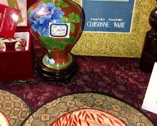 Lot 2534. $60.00. Travel the world in one Lot! Cloisonne vase, with stand. 1 cloisonne ornament and 1 green glass ornament, both in their own presentation boxes, an interesting trivet/wall hanging, cloisonne: frame, pin, clippers, candlesticks, circle silks, 3 Egyptian "papyrus" prints. Please note that each one of these items might make a good gift, as nearly all have not been used or displayed and some are in orig. boxes. Do all your Holiday Shopping in one click!