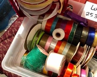 Lot #2535. $28.00. Plastic container full of various ribbons. Great for gift wrapping, crafts, or other projects. Some of these rolls were quite expensive; yours for a fraction of what was originally paid. Includes containers.