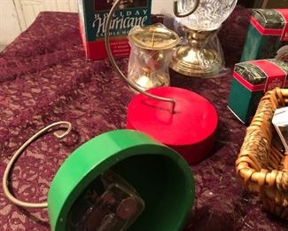 ot 2538. $35.00. Mixture of a red and green music box/ornament holders, 4 Hallmark Keepsake ornaments in their boxes, one leaded crystal Hurricane Lamp for a candle in original box, another candle holder, and a basket with 3 cute cheap ornaments in boxes. Nice lot.