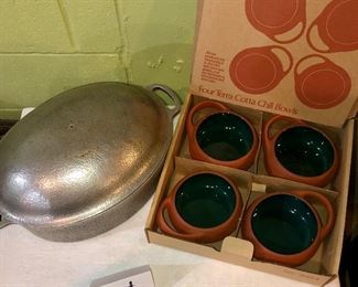 Lot 2539. $50.00. 4 terracotta chili bowls by Brett Bortner design (believed to be from Crate & Barrel, a and Club Aluminum vintage dutch oven, needs new knob but in great shape otherwise.