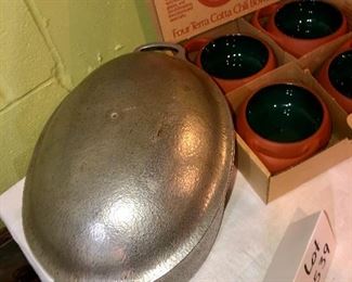 Lot 2539. $50.00. 4 terracotta chili bowls by Brett Bortner design (believed to be from Crate & Barrel), and Club Aluminum vintage dutch oven, needs a new knob but in great shape otherwise.