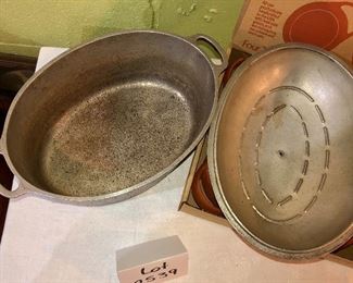Lot 2539. $50.00. 4 terracotta chili bowls by Brett Bortner design (believed to be from Crate & Barrel), and Club Aluminum vintage dutch oven, needs new knob but in great shape otherwise.