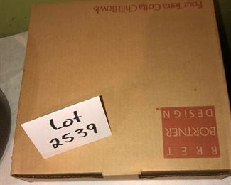 Lot 2539. $50.00. 4 terracotta chili bowls by Brett Bortner design (believed to be from Crate & Barrel, new in box, and Club Aluminum vintage dutch oven, needs new knob but in great shape otherwise.