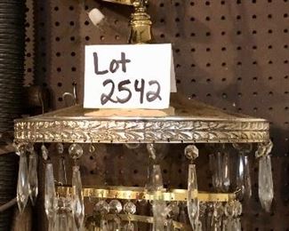 Lot 2542 $300.00. Incredible brass and crystal chandelier. 4 tiers. I didn't have time to get all the crystals in, but there are a lot of crystals in a box
