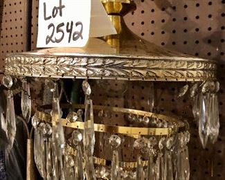 Lot 2542 $300.00. Incredible brass and crystal chandelier. 4 tiers. I didn't have time to get all the crystals in, but there are a lot of crystals in a box