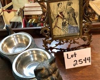 Lot 2544 $50.00. Cast Iron Frame (broken glass) and Cat Bowl