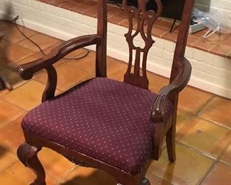 Heckman Dining Table with Two Silver Drawers, Two Extensions (each measures 20" wide), Two Arm/Captain's Chairs, and Six Side Chairs.  Width of the Table is Four Feet, Length of Table without Extensions Six Feet Five Inches, Length of Table with Leaves/Extensions is Ten Feet, Chairs are Upholstered with a Burgundy Fabric with Gold Accent