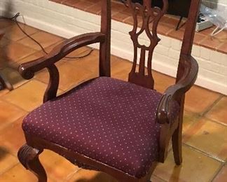 Heckman Dining Table with Two Silver Drawers, Two Extensions (each measures 20" wide), Two Arm/Captain's Chairs, and Six Side Chairs.  Width of the Table is Four Feet, Length of Table without Extensions Six Feet Five Inches, Length of Table with Leaves/Extensions is Ten Feet, Chairs are Upholstered with a Burgundy Fabric with Gold Accent