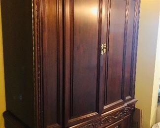 Wellington Hall Solid Wood Armoire/Entertainment Center, Two Pieces, A Base and a Hutch, Height of Front Section Seven Feet Two and a Half Inches, Height of Sides Six Feet Nine Inches, Width Three Feet Nine Inches, Depth Twenty-Three and a Half Inches with Adjustable Shelves, Electrical Entry Access