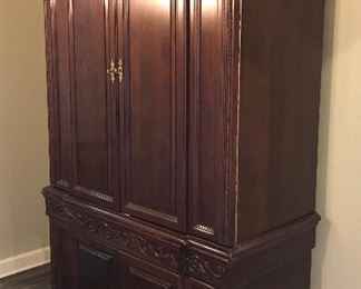 Wellington Hall Solid Wood Armoire/Entertainment Center, Two Pieces, A Base and a Hutch, Height of Front Section Seven Feet Two and a Half Inches, Height of Sides Six Feet Nine Inches, Width Three Feet Nine Inches, Depth Twenty-Three and a Half Inches with Adjustable Shelves, Electrical Entry Access