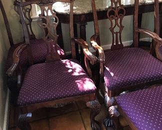 Heckman Dining Table with Two Silver Drawers, Two Extensions (each measures 20" wide), Two Arm/Captain's Chairs, and Six Side Chairs.  Width of the Table is Four Feet, Length of Table without Extensions Six Feet Five Inches, Length of Table with Leaves/Extensions is Ten Feet, Chairs are Upholstered with a Burgundy Fabric with Gold Accent