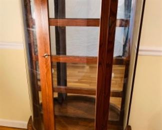 Handcrafted Oak Curved Glass curio cabinet with claw feet.  4 shelves. Stands approx  5 feet tall x  35 inches wide and 14 inches deep 