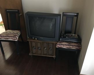 Two black wood/upholstered chairs, $15 each. One vintage brown wood storage cabinet with doors that open, $15