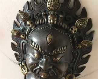 Metal face sculpture. 