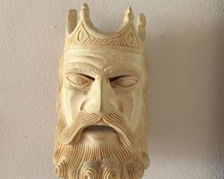 Wood carving of kings face