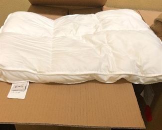 loads of these tiny feather beds - great for dogs! 