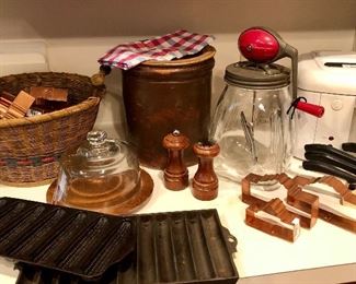Nice assortment of vintage kitchen ware...Daisey Glass churn, Griswold cornbread and breadstick pans, brown crock and Copper Cookie Cutters shaped like the Alamo!  