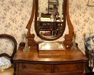 Antique three drawer dressing table with fancy shaped beveled mirror