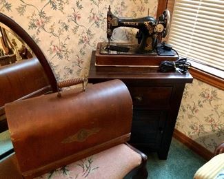 Ornate Singer Sewing Machine with Oak carrying case.