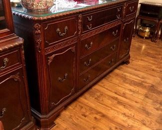 Vintage buffet with glass top protector. Seven drawers and two cabinets.  Matching dining table and China cabinet sold separately.