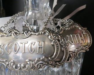 Sterling silver whiskey tags.