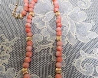 14 kt gold bead and coral necklace.