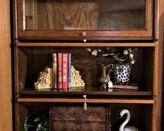 You are giving your den, study, or home office area a sophisticated piece of furniture when you choose wood barrister bookcases to display your books.