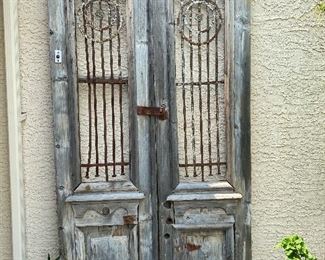 Old rustic wood and iron entry doors yard/garden art sold together 95in tall 22.5in wide each door HxWxD