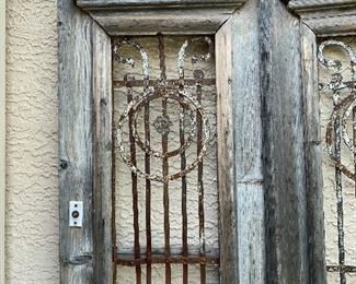 Old rustic wood and iron entry doors yard/garden art sold together 95in tall 22.5in wide each door HxWxD