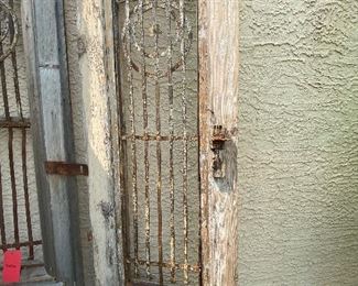 Old rustic wood and iron entry doors yard/garden art sold together 95in tall 22.5in wide each door HxWxD