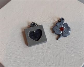 R tennesmed Sweden (L) $22 Clover pendant (R) $6