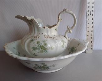 W.H. Grindley & Co England Semi-Porcelain Pitcher & Wash Basin "Daisy". Crazing, small nick on underside of basin rim, small nick on inside of pitcher rim.   $125