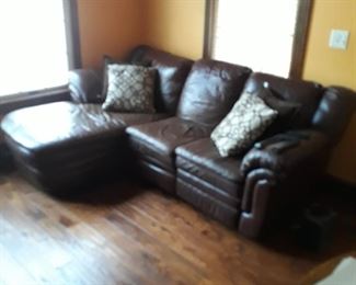 Three piece sectional sofa with recliner, leather like touch , chocolate 