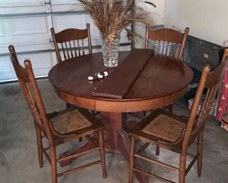 Another Oak Table  with Cane Bottom Chairs