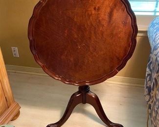 16. Tilt-top mahogany table 24”R x 25.5”H (as is). $85