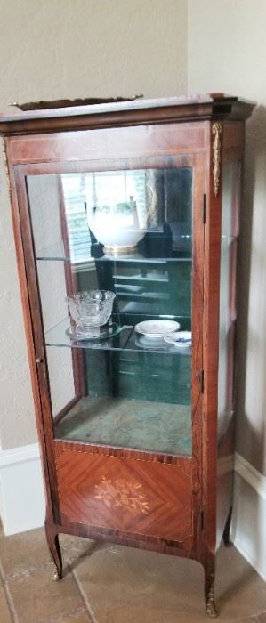 Slender antique curio cabinet