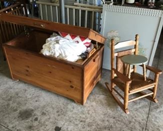 Large Cedar Chest open next to a small Child’s Rocker 